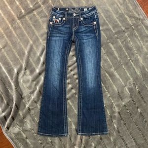 Miss Me boot cut jeans in line new condition. Girls size 7